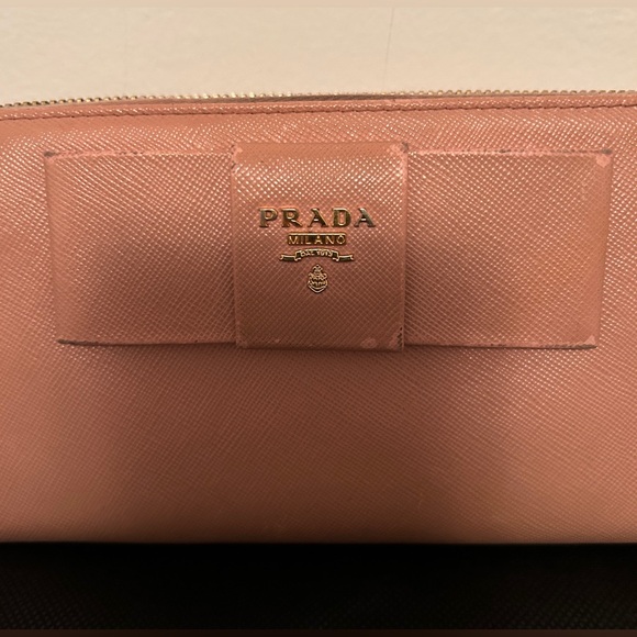 Prada Handbags - Prada Saffiano Fiocco Bow Zippy Long Wallet in the color Orchidea. With COA
